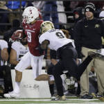 Washington State wide receiver Gabe Marks, left, is pushed out of bounds by Colorado defensive back Tedric Thompson during the second half of an NCAA college football game, Saturday, Nov. 21, 2015, in Pullman, Wash. Washington State won 27-3. (AP Photo/Young Kwak)