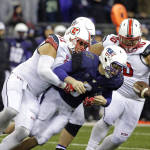 Washington quarterback Jake Browning (3) fumbles as he is tackled by Utah defensive end Kylie Fitts (11) during the second half of an NCAA college football game, Saturday, Nov. 7, 2015, in Seattle. The fumble was recovered by defensive tackle Stevie Tu'ikolovatu, right, and Utah beat Washington 34-23. (AP Photo/Ted S. Warren)