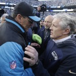 Carolina Panthers head coach Ron Rivera, left, speaks with Seattle Seahawks head coach Pete Carroll after the second half of an NFL divisional playoff football game, Sunday, Jan. 17, 2016, in Charlotte, N.C. The Panthers won 31-24. (AP Photo/Bob Leverone)
