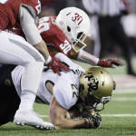 Washington State safety Taylor Taliulu (30) brings down Colorado wide receiver Nelson Spruce (22) during the first half of an NCAA college football game, Saturday, Nov. 21, 2015, in Pullman, Wash. (AP Photo/Young Kwak)