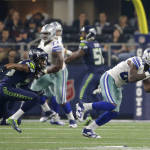 Seattle Seahawks cornerback Richard Sherman (25) watches as Dallas Cowboys' Dez Bryant (88) grabs a pass in the second half of an NFL football game Sunday, Nov. 1, 2015, in Arlington, Texas. (AP Photo/Brandon Wade)