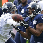 Seattle Seahawks wide receiver Percy Harvin, right, makes a catch as cornerback Terrell Thomas, left, defends, during practice drills, Saturday, Aug. 2, 2014, at NFL football training camp in Renton, Wash. (AP Photo/Ted S. Warren)