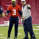 Seattle Seahawks' Russell Wilson (3) talks with quarterback coach Carl Smith during a team practice for NFL Super Bowl XLIX football game, Friday, Jan. 30, 2015, in Tempe, Ariz. The Seahawks play the New England Patriots in Super Bowl XLIX on Sunday, Feb. 1, 2015. (AP Photo/Matt York)