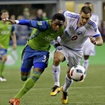 Seattle Sounders forward Oalex Anderson, left, challenges Montreal Impact's Donny Toia for the ball during the second half of an MLS soccer match, Saturday, April 2, 2016, in Seattle. Toia was given a yellow card on the play. The Sounders won 1-0. (AP Photo/Ted S. Warren)