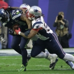 New England Patriots outside linebacker Dont'a Hightower (54) and Rob Ninkovich stop Seattle Seahawks running back Marshawn Lynch (24) during the first half of NFL Super Bowl XLIX football game Sunday, Feb. 1, 2015, in Glendale, Ariz. (AP Photo/David J. Phillip)