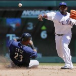 Texas Rangers shortstop Hanser Alberto (2) throws to first to turn a double play after forcing out Seattle Mariners Nelson Cruz (23) at second during the third inning of a baseball game Wednesday, April 6, 2016, in Arlington, Texas. (AP Photo/Brandon Wade)