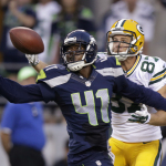 Seattle Seahawks cornerback Byron Maxwell (41) breaks up a pass intended for Green Bay Packers wide receiver Jordy Nelson (87) during the second half of an NFL football game, Thursday, Sept. 4, 2014, in Seattle. (AP Photo/Stephen Brashear)