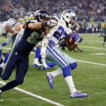 Seattle Seahawks tight end Luke Willson (82) tackles Dallas Cowboys' J.J. Wilcox after Wilcox recovered a blocked field goal in the second half of an NFL football game Sunday, Nov. 1, 2015, in Arlington, Texas. (AP Photo/Brandon Wade)