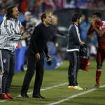 FC Dallas head coach Oscar Pareja, middle, on the sidelines against the Seattle Sounders FC during the overtime period of an MLS soccer western conference semifinal playoff match, Sunday, Nov. 8, 2015, in Frisco, Texas. Dallas won 4-2 on penalty kicks. (AP Photo/Brad Loper)