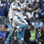 Carolina Panthers quarterback Cam Newton (1) celebrates with Carolina Panthers outside linebacker Thomas Davis (58) after Davis caught the onside kick made by Seattle Seahawks during the second half of an NFL divisional playoff football game, Sunday, Jan. 17, 2016, in Charlotte, N.C. The Panthers won 31-24. (AP Photo/Bob Leverone)