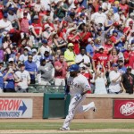 Fans cheer as Texas Rangers designated hitter Prince Fielder (84) rounds the bases after hitting a three-run home run during the sixth inning of a baseball game against the Seattle Mariners Wednesday, April 6, 2016, in Arlington, Texas. (AP Photo/Brandon Wade)