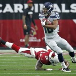 Seattle Seahawks wide receiver Tyler Lockett (16) breaks the tackle of Arizona Cardinals strong safety Deone Bucannon (20) during the first half of an NFL football game, Sunday, Jan. 3, 2016, in Glendale, Ariz. (AP Photo/Rick Scuteri)