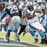 Carolina Panthers running back Jonathan Stewart (28) runs into the end zone for a touchdown against Seattle Seahawks free safety Earl Thomas (29) during the first half of an NFL divisional playoff football game, Sunday, Jan. 17, 2016, in Charlotte, N.C. (AP Photo/Bob Leverone)