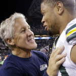 Seattle Seahawks coach Pete Carroll, left, greets Green Bay Packers' Nick Perry after an NFL football game, Thursday, Sept. 4, 2014, in Seattle. The Seahawks defeated the Packers 36-16. (AP Photo/Elaine Thompson)
