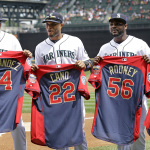 Seattle Mariners' Felix Hernandez, Robinson Cano, Fernando Rodney and Kyle Seager, from left, hold All-Star jerseys in a presentation before the Mariners' baseball game against the Oakland Athletics on Sunday, July 13, 2014, in Seattle. (AP Photo/Elaine Thompson)