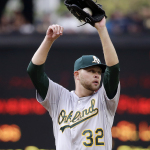 Oakland Athletics starting pitcher Jesse Hahn stretches after Seattle Mariners' Nelson Cruz scored during the first inning of a baseball game Saturday, May 9, 2015, in Seattle. (AP Photo/Elaine Thompson)