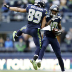 Seattle Seahawks wide receiver Paul Richardson, right, celebrates a catch with teammate Doug Baldwin (89) in the second half of an NFL football game against the St. Louis Rams, Sunday, Dec. 28, 2014, in Seattle. (AP Photo/John Froschauer)