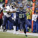 Seattle Seahawks' Kevin Norwood (81) tries to fend offSt. Louis Rams' Janoris Jenkins on a 31-yard pass reception during the second half of an NFL football game, Sunday, Dec. 28, 2014, in Seattle. The Seahawks scored on the next play on the way to a 20-6 win. (AP Photo/Elaine Thompson)