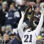 Seattle Seahawks wide receiver Paul Richardson, top, makes a leaping reception against the defense of St. Louis Rams' Janoris Jenkins (21) in the second half of an NFL football game, Sunday, Dec. 28, 2014, in Seattle. (AP Photo/Scott Eklund)