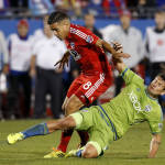 Seattle Sounders FC forward Nelson Valdez, right, knocks the ball away from FC Dallas midfielder Victor Ulloa (8)  during the second half of an MLS soccer western conference semifinal playoff match, Sunday, Nov. 8, 2015, in Frisco, Texas. Dallas won 4-2 on penalty kicks. (AP Photo/Brad Loper)