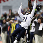 Seattle Seahawks wide receiver Paul Richardson, top, makes a leaping reception against the defense of St. Louis Rams' Janoris Jenkins (21) in the second half of an NFL football game, Sunday, Dec. 28, 2014, in Seattle. (AP Photo/John Froschauer)