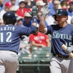 Seattle Mariners' Leonys Martin (12) is congratulated by Kyle Seager (15) after hitting a solo home run during the second inning of a baseball game against the Texas Rangers Wednesday, April 6, 2016, in Arlington, Texas. (AP Photo/Brandon Wade)