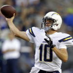 San Diego Chargers quarterback Kellen Clemens passes in the first half of a preseason NFL football game against the Seattle Seahawks, Friday, Aug. 15, 2014, in Seattle. (AP Photo/Stephen Brashear)