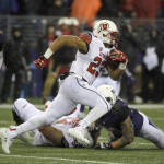 Utah running back Devontae Booker (23) runs against Washington during the first half of an NCAA college football game, Saturday, Nov. 7, 2015, in Seattle. (AP Photo/Ted S. Warren)