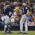 Seattle Mariners starting pitcher Mike Montgomery, right, is congratulated by catcher Mike Zunino after the Mariners' 5-0 victory in a baseball game in which the San Diego Padres managed only one hit, Tuesday, June 30, 2015, in San Diego.  (AP Photo/Lenny Ignelzi)