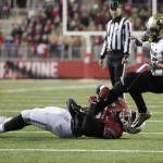 Colorado running back Phillip Lindsay (23) is tripped  by Washington State linebacker Kache Palacio during the second half of an NCAA college football game, Saturday, Nov. 21, 2015, in Pullman, Wash. Washington State won 27-3. (AP Photo/Young Kwak)