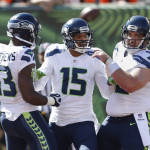 Seattle Seahawks wide receiver Jermaine Kearse (15) celebrates after a touchdown with wide receiver Chris Matthews (13) and center Drew Nowak (62) in the first half of an NFL football game against the Cincinnati Bengals, Sunday, Oct. 11, 2015, in Cincinnati. (AP Photo/Gary Landers)