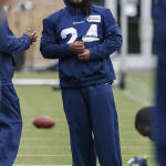 Seattle Seahawks running back Marshawn Lynch stands on the sidelines during a drill at an NFL football minicamp Thursday, June 18, 2015, in Renton, Wash. (AP Photo/Joe Nicholson)