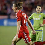 FC Dallas defender Walker Zimmerman (25) reacts to scoring the teams second goal as Seattle Sounders FC midfielder Marco Pappa (10) looks on during the second half of an MLS soccer western conference semifinal playoff match, Sunday, Nov. 8, 2015, in Frisco, Texas. (AP Photo/Brad Loper)