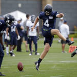 Seattle Seahawks kicker Steven Hauschka (4) steps over the ball during a drill at an NFL football training camp Monday, Aug. 3, 2015, in Renton, Wash. (AP Photo/Elaine Thompson)