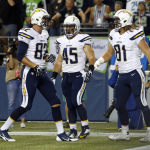San Diego Chargers tight end Jake Byrne (81) celebrates his touchdown in the second half of a preseason NFL football game against the Seattle Seahawks, with teammates Ryan Otten, left, and Zach Boren (45), Friday, Aug. 15, 2014, in Seattle. (AP Photo/John Froschauer)