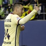 Club America captain Rubens Sambueza gives a thumbs-up to fans as he leaves the pitch after Club America tied the Seattle Sounders 2-2 in a CONCACAF Champions League soccer quarterfinal, Tuesday, Feb. 23, 2016, in Seattle. (AP Photo/Ted S. Warren)