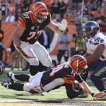 Cincinnati Bengals quarterback Andy Dalton (14) dives for a touchdown in the second half of an NFL football game against the Seattle Seahawks, Sunday, Oct. 11, 2015, in Cincinnati. The Bengals won 27-24. (AP Photo/Gary Landers)