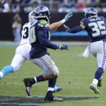 Seattle Seahawks cornerback DeShawn Shead (35) runs the ball after a fake punt against the Carolina Panthers during the second half of an NFL divisional playoff football game, Sunday, Jan. 17, 2016, in Charlotte, N.C. (AP Photo/Mike McCarn)