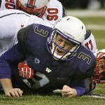 Washington quarterback Jake Browning (3) reacts after he fumbled and was tackled by Utah defensive end Kylie Fitts (11) during the second half of an NCAA college football game Saturday, Nov. 7, 2015, in Seattle. The fumble was recovered by defensive tackle Stevie Tu'ikolovatu (90). Utah won 34-23. (AP Photo/Ted S. Warren)