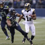 St. Louis Rams' Tavon Austin runs with the ball as Seattle Seahawks' Bobby Wagner gives chase in the first half of an NFL football game, Sunday, Dec. 27, 2015, in Seattle. (AP Photo/Stephen Brashear)