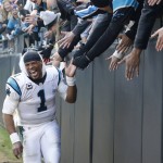 Carolina Panthers quarterback Cam Newton (1) celebrates with fans after the second half of an NFL divisional playoff football game against the Seattle Seahawks, Sunday, Jan. 17, 2016, in Charlotte, N.C. The Panthers won 31-24.  (AP Photo/Bob Leverone)
