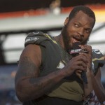 Seattle Seahawks defensive end Michael Bennett, of Team Irvin, reacts after winning the defensive MVP award in the NFL Pro Bowl football game Sunday, Jan. 31, 2016, in Honolulu. Team Irving beat Team Rice 49-27. (AP Photo/Marco Garcia)