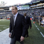 NFL Commissioner Roger Goodell walks on the field before an NFL football game between the Seattle Seahawks and the Green Bay Packers, Thursday, Sept. 4, 2014, in Seattle. (AP Photo/Elaine Thompson)
