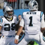 Carolina Panthers running back Jonathan Stewart (28) celebrates his touchdown with Carolina Panthers quarterback Cam Newton (1) against the Seattle Seahawks during the first half of an NFL divisional playoff football game, Sunday, Jan. 17, 2016, in Charlotte, N.C. (AP Photo/Chuck Burton)