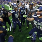 Seattle Seahawks players get fired up on the field before the NFL Super Bowl XLIX football game against the New England Patriots Sunday, Feb. 1, 2015, in Glendale, Ariz. (AP Photo/David J. Phillip)