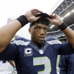 Seattle Seahawks quarterback Russell Wilson leaves the field after the Carolina Panthers defeated his team 27-23 in an NFL football game, Sunday, Oct. 18, 2015, in Seattle. (AP Photo/Elaine Thompson)
