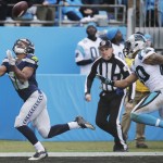 Seattle Seahawks wide receiver Tyler Lockett (16) makes a touchdown catch against Carolina Panthers free safety Kurt Coleman (20) during the second half of an NFL divisional playoff football game, Sunday, Jan. 17, 2016, in Charlotte, N.C. (AP Photo/Chuck Burton)