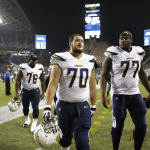 San Diego Chargers Chas Alecxih (70) and King Dunlap (77) leave the field after a preseason NFL football game against the Seattle Seahawks, Friday, Aug. 15, 2014, in Seattle. The Seahawks beat the Chargers 41-14. (AP Photo/Stephen Brashear)