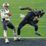 Seattle Seahawks wide receiver Chris Matthews (13) catches an 11-yard touchdown pass against New England Patriots cornerback Logan Ryan (26) during the first half of NFL Super Bowl XLIX football game Sunday, Feb. 1, 2015, in Glendale, Ariz. (AP Photo/Brynn Anderson)