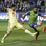 Club America forward Oribe Peralta, left, has a shot on goal deflected by Seattle Sounders defender Tyrone Mears during the first half of a CONCACAF Champions League soccer quarterfinal, Tuesday, Feb. 23, 2016, in Seattle. (AP Photo/Ted S. Warren)